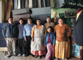 Family of tailors. La Paz Bolivia, 2010. Lambda print, hand retouching, 46.4 x 61.8 in. Familia de sastres /Impresión sobre papel Lambda retocada a mano, 118 x 157 cm.